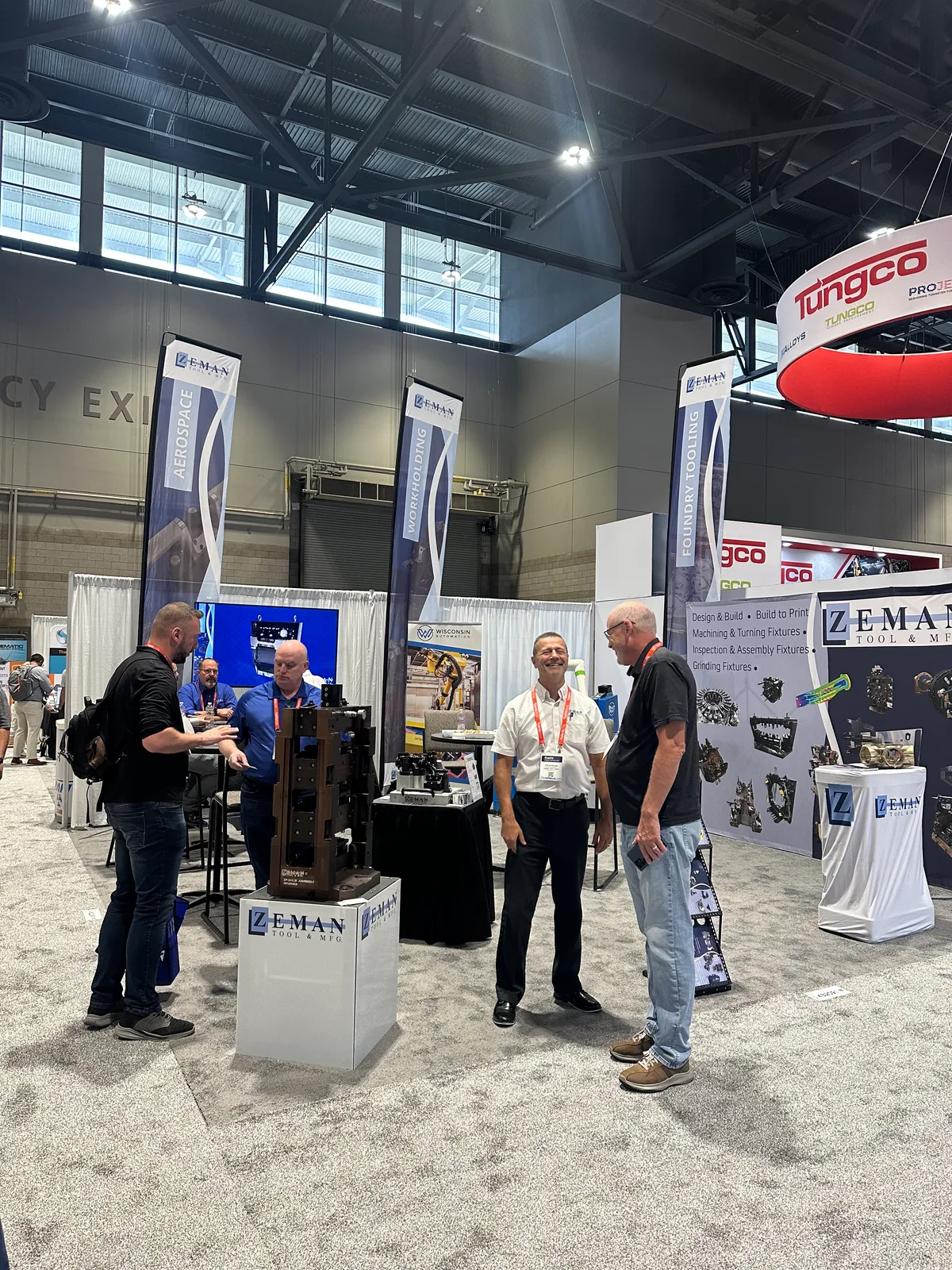 Zeman Tool team welcoming visitors at the IMTS 2026 exhibit booth