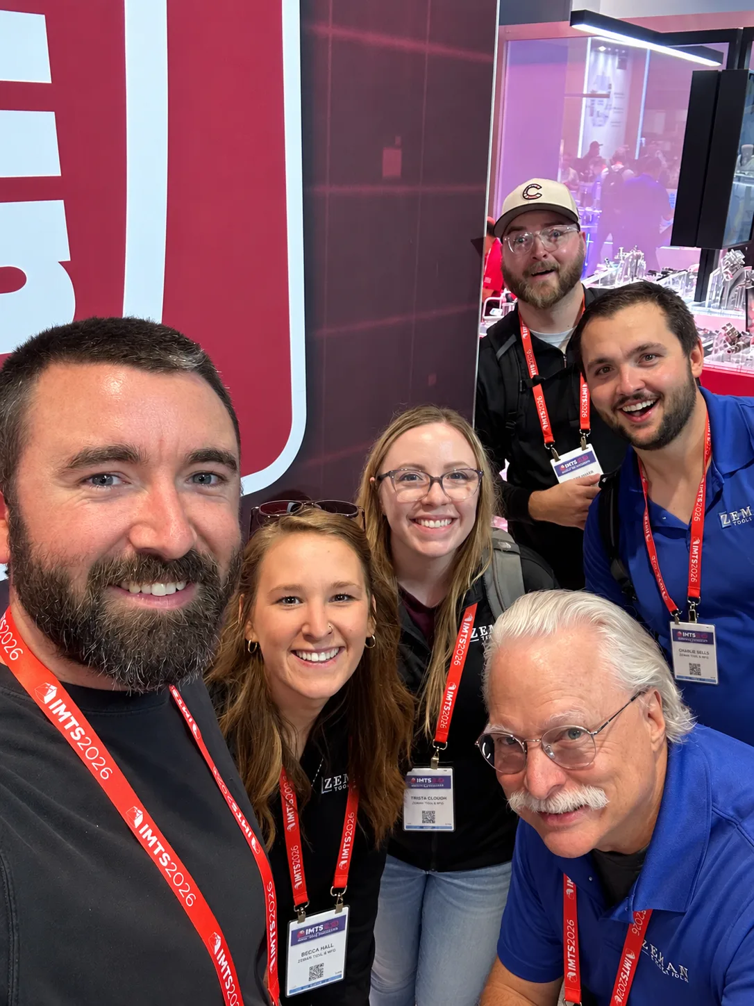 Zeman Tool team group selfie at IMTS 2026